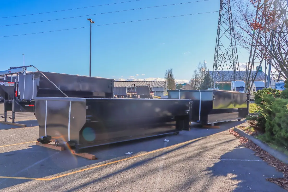Roll-off dumpster ready for waste disposal at job site for Demolition Dumpster Rental in Geneva